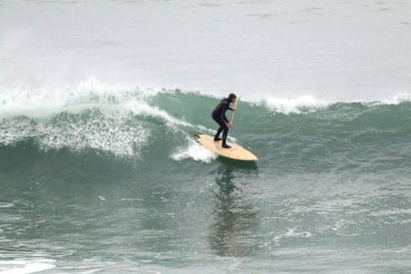 Randy Bogardus riding his own handmade ocean surfboard SUP